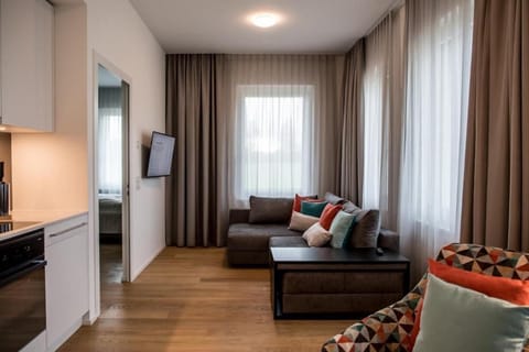 Junior Apartment | Living room | 32-inch flat-screen TV with digital channels