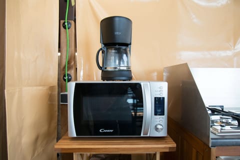 Full-size fridge, microwave, stovetop, coffee/tea maker