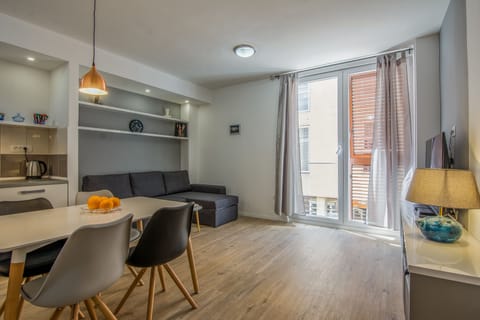 Apartment, 2 Bedrooms | Living area | 42-inch flat-screen TV with cable channels, TV