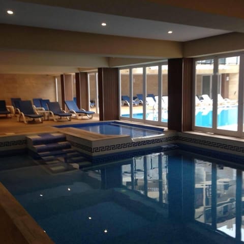 Indoor pool, seasonal outdoor pool, pool umbrellas, sun loungers