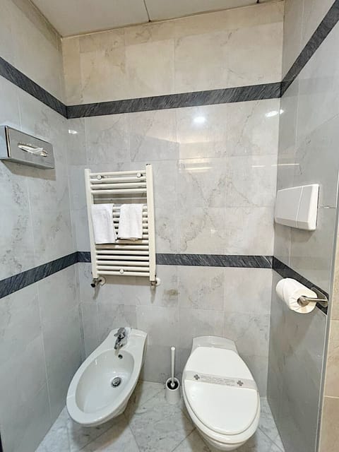 Shower, free toiletries, hair dryer, slippers