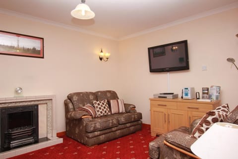 Cottage, 3 Bedrooms | Living room | LCD TV, fireplace, DVD player