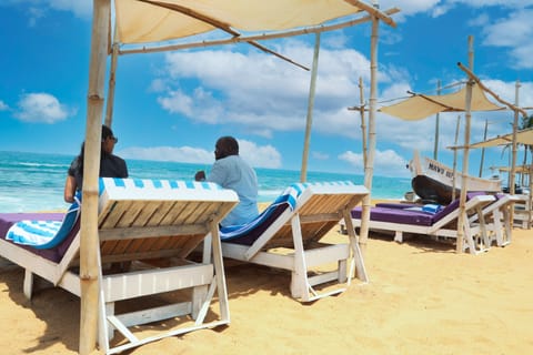 Private beach, white sand, sun loungers, beach umbrellas