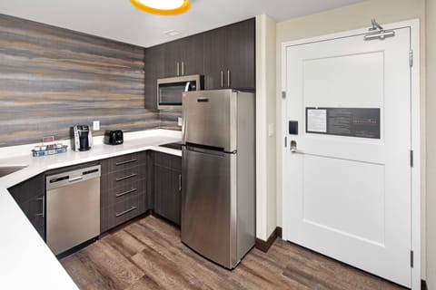 Suite, 1 Bedroom | Private kitchen | Fridge, microwave, stovetop, dishwasher