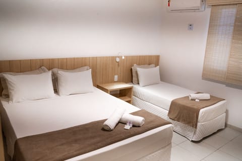 Triple Room, Multiple Beds, Non Smoking | Premium bedding, minibar, desk, blackout drapes