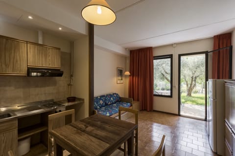 Apartment, 1 Bedroom, Patio | Living area | 32-inch TV with satellite channels