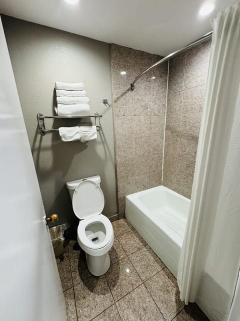 Room, 2 Queen Beds, Non Smoking | Bathroom | Combined shower/tub, towels, soap, shampoo