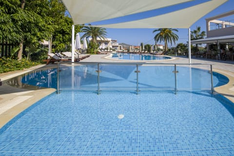 Seasonal outdoor pool, open 8:00 AM to 7:00 PM, pool umbrellas