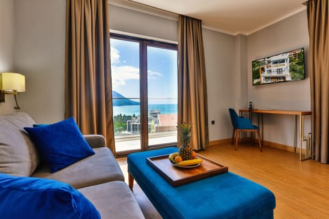 Deluxe Suite, 2 Bedrooms, Sea View | Minibar, in-room safe, desk, blackout drapes