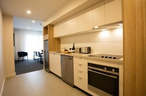 Two Bedroom Apartment | Private kitchen | Full-size fridge, microwave, stovetop, coffee/tea maker