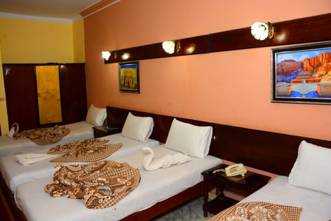 Family Room, City View | In-room safe, blackout drapes, free WiFi, bed sheets