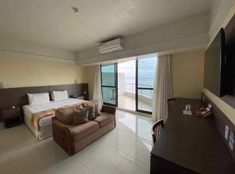 Luxury Room | Living area | 49-inch LCD TV with cable channels, TV