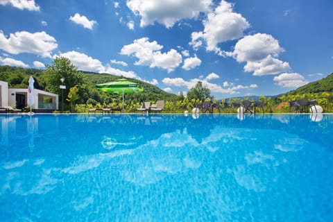 Outdoor pool, pool umbrellas, sun loungers