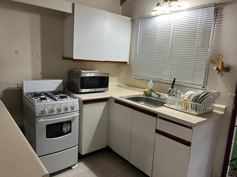 Basic House, 2 Bedrooms, Non Smoking | Private kitchen | Full-size fridge, microwave, oven, stovetop