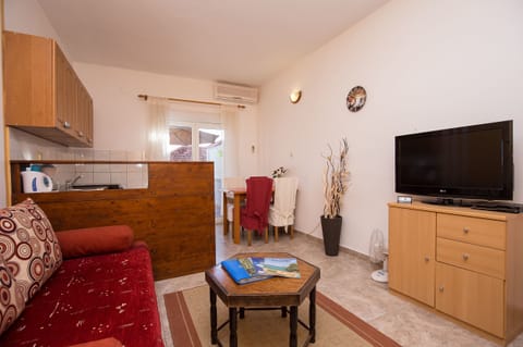 Economy Apartment, Terrace, Garden Area | Desk, blackout drapes, iron/ironing board, free WiFi