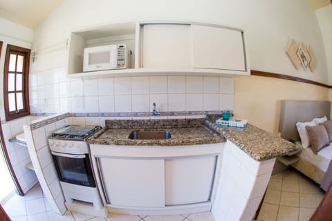 Apartment, Sea View, Ground Floor | Private kitchen | Full-size fridge, microwave, electric kettle, cookware/dishes/utensils