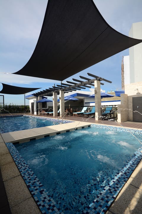 Outdoor pool, open 7:30 AM to 10:00 PM, pool umbrellas, sun loungers