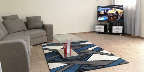 Apartment, Non Smoking | Living area | 46-inch Smart TV with cable channels, TV