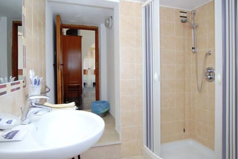 Triple Room, Balcony, Sea View | Bathroom | Shower, free toiletries, hair dryer, slippers