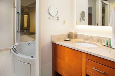 Suite, 1 King Bed with Sofa bed, Jetted Tub | Bathroom | Separate tub and shower, free toiletries, hair dryer, towels