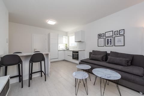 Apartment, 1 Bedroom, Terrace | Living room | 45-inch flat-screen TV with cable channels