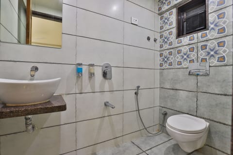 Deluxe Non Ac Room | Bathroom | Shower, rainfall showerhead, slippers, towels