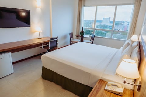 Premium Room, 1 King Bed | Premium bedding, minibar, in-room safe, individually decorated