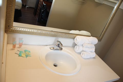 Room, 2 Queen Beds, Non Smoking | Bathroom | Combined shower/tub, free toiletries, towels