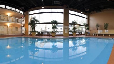 Indoor pool, seasonal outdoor pool, open 7 AM to 10 PM, pool umbrellas