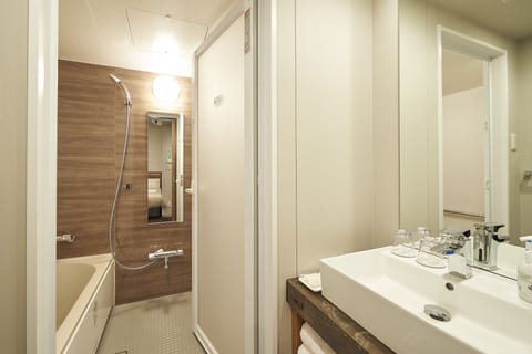 Deluxe Twin Room, Non Smoking | Bathroom | Free toiletries, hair dryer, slippers, electronic bidet