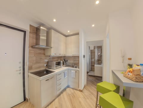 Family Apartment, 2 Bedrooms | Private kitchen | Full-size fridge, microwave, stovetop, dishwasher