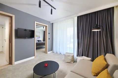 Suite, Balcony | Living area | 108-cm flat-screen TV with satellite channels, TV