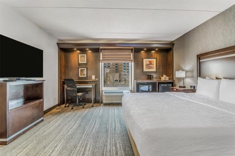 Desk, laptop workspace, blackout drapes, iron/ironing board