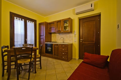 Apartment, 1 Bedroom | Private kitchen | Full-size fridge, stovetop, cookware/dishes/utensils