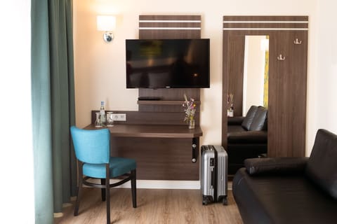 Junior Suite | Living area | Flat-screen TV