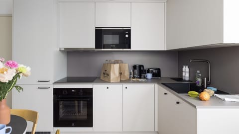 Finnish Design Penthouse w/ Sauna | Private kitchen | Full-size fridge, microwave, stovetop, dishwasher