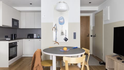 Finnish Design Penthouse | Private kitchen | Full-size fridge, microwave, stovetop, dishwasher