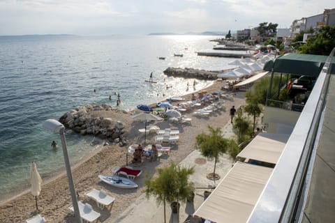 On the beach, sun loungers, beach umbrellas