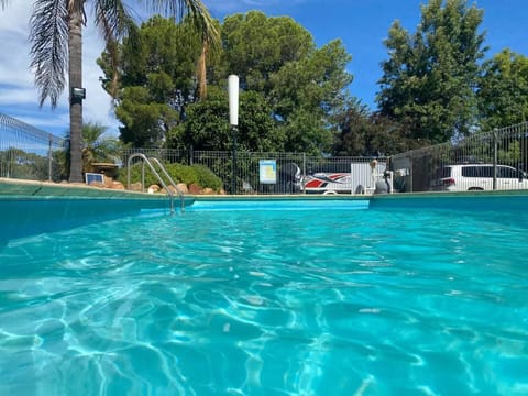 Seasonal outdoor pool, open noon to 8:00 PM, pool umbrellas