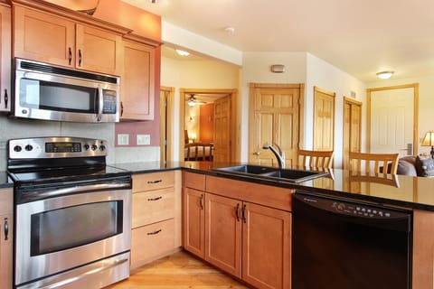 Condo, 2 Bedrooms | Private kitchen | Fridge, microwave, oven, dishwasher