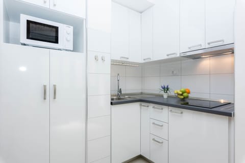 Apartment | Private kitchen | Full-size fridge, microwave, stovetop, coffee/tea maker