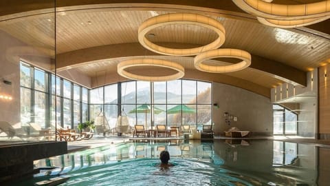 Indoor pool, pool umbrellas, sun loungers