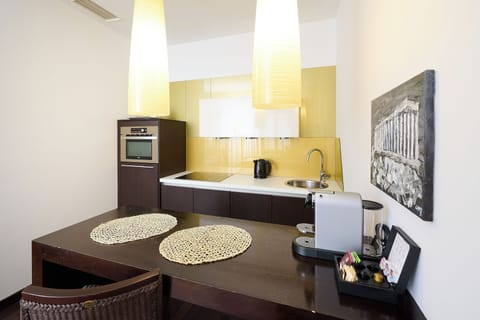 Junior Suite, 1 King Bed | Private kitchen | Full-size fridge, microwave, oven, stovetop