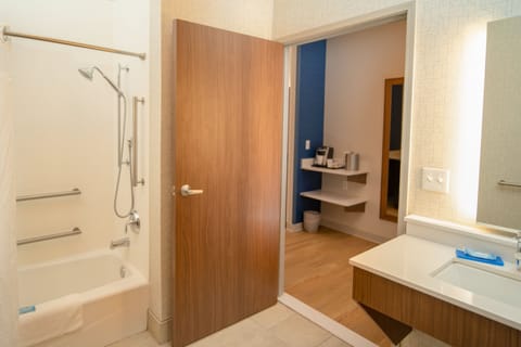 Suite, 1 King Bed | Bathroom | Combined shower/tub, designer toiletries, hair dryer, towels