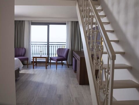 Family Room, Partial Sea View | Premium bedding, minibar, in-room safe, desk