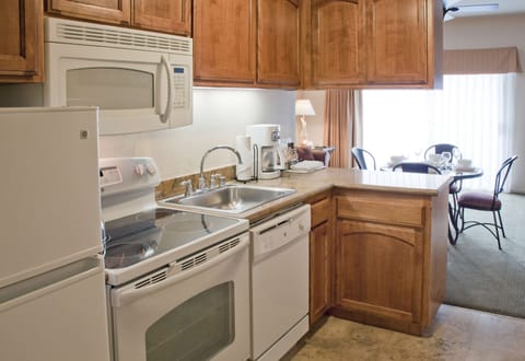 Microwave, coffee/tea maker, freezer, dining tables