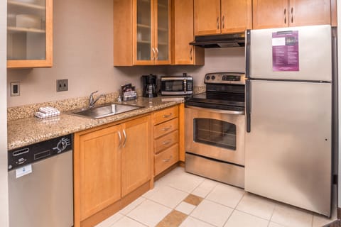 Suite, 2 Bedrooms | Private kitchen | Full-size fridge, microwave, stovetop, dishwasher