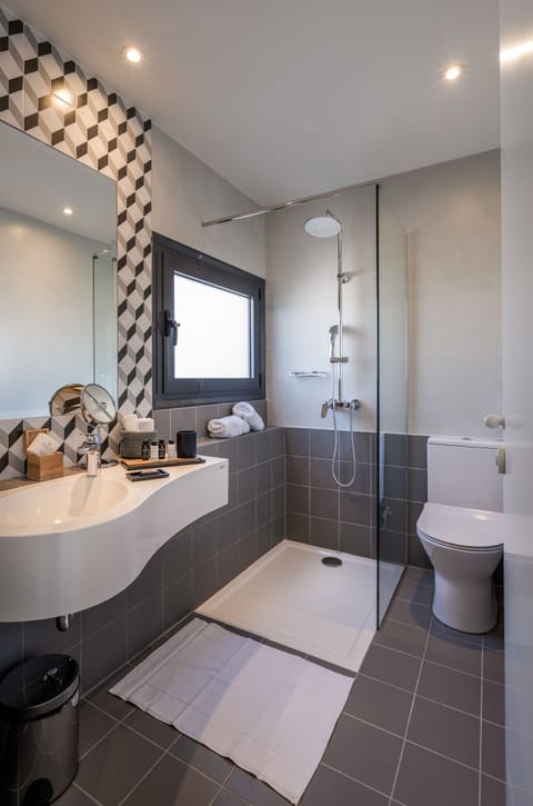 Acropolis Loft | Bathroom | Shower, rainfall showerhead, designer toiletries, hair dryer