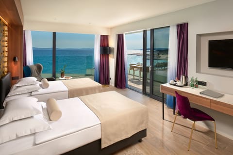 Deluxe Double or Twin Room, Sea View | Minibar, in-room safe, desk, blackout drapes