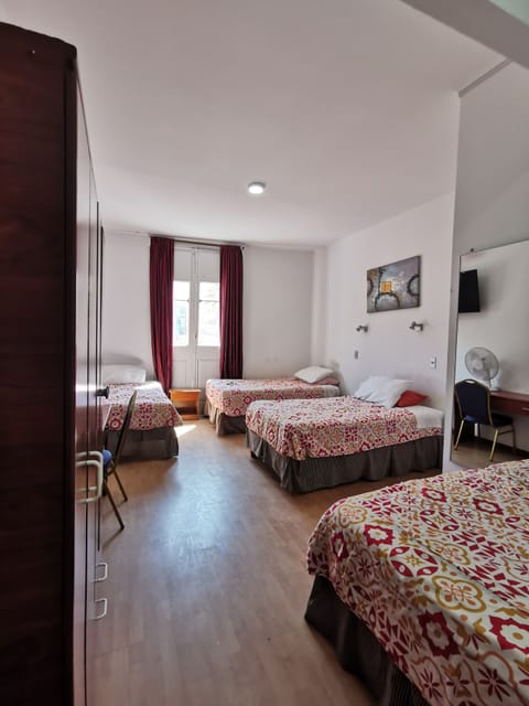 Quadruple Room, Balcony | In-room safe, desk, free WiFi, bed sheets